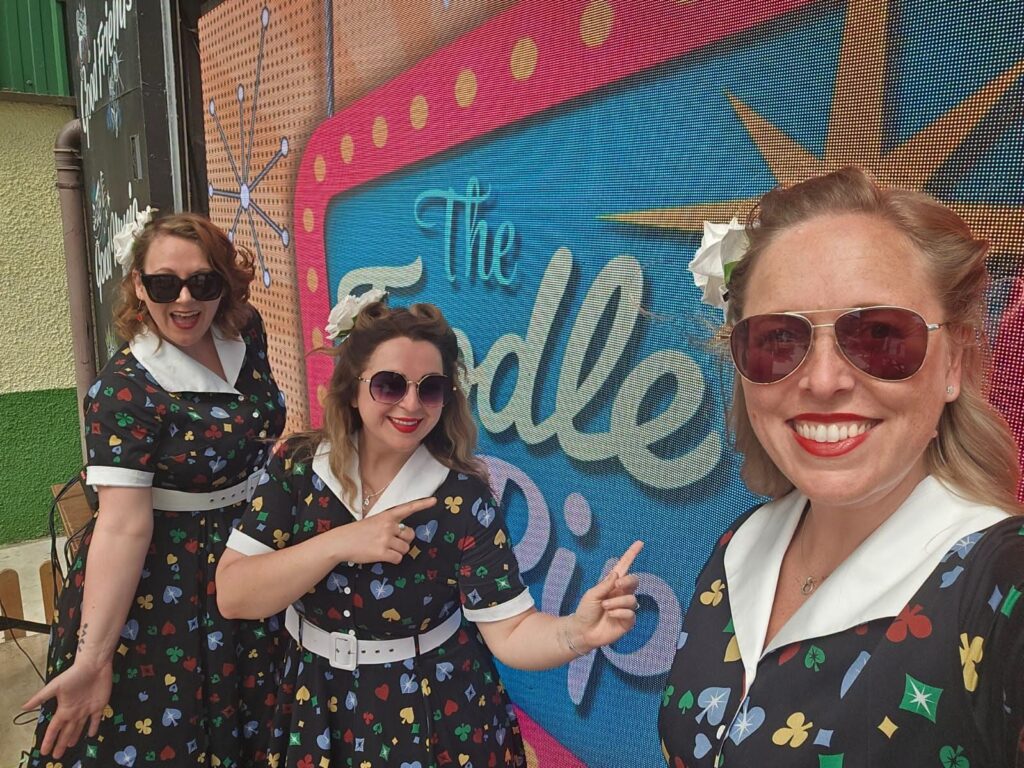 The Toodle Pips together in matching vintage-inspired dresses